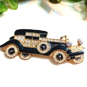 Old Rolls rhinestone brooch